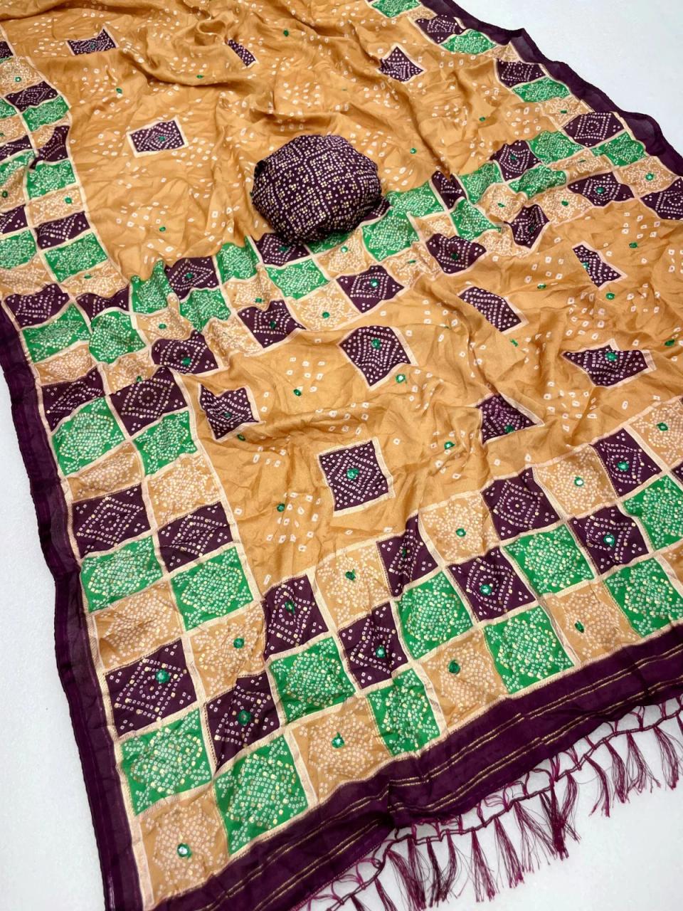 Premium Pure Moss Chiffon Saree With Beautiful Bandhani Print With Foil Print With Mirror Work Designer Saree With Tussles in Pallu Two tone color Contrast Printed Border and Designer Blouse Piece. in Orange