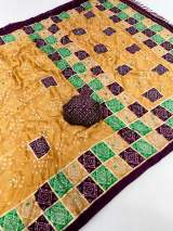 Premium Pure Moss Chiffon Saree With Beautiful Bandhani Print With Foil Print With Mirror Work Designer Saree With Tussles in Pallu Two tone color Contrast Printed Border and Designer Blouse Piece. in Orange – view 2